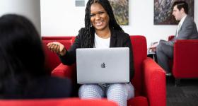 Master of Project Management student wit laptop